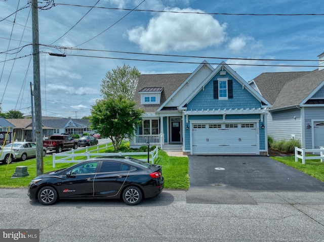 37529 Atlantic Ave Unit 11, Rehoboth Beach, DE 19971 - view of front of house with driveway, a front lawn, and a garage