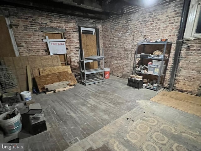 2341 Annapolis Rd, Baltimore, MD 21230 - living area with brick wall and wood finished floors