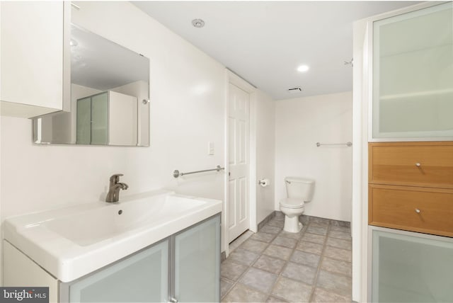 374 Shurs Ln Unit 304, Philadelphia, PA 19128 - bathroom featuring vanity, toilet, stone finish flooring, and baseboards