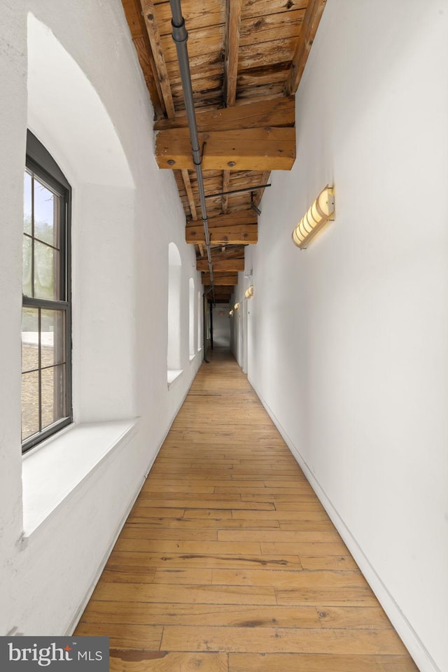 374 Shurs Ln Unit 304, Philadelphia, PA 19128 - hallway with wood ceiling with exposed beams, light wood-style floors, and arched walkways