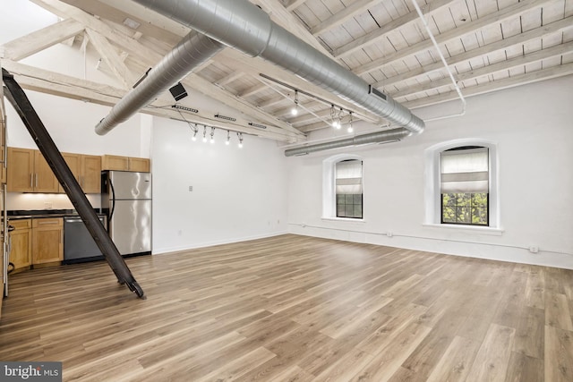374 Shurs Ln Unit 304, Philadelphia, PA 19128 - basement featuring freestanding refrigerator, wooden ceiling, light wood-style floors, plenty of natural light, and baseboards