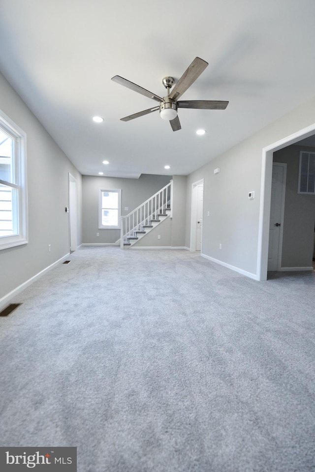 307 4th St, Seaford, DE 19973 - unfurnished living room with stairs, a ceiling fan, baseboards, recessed lighting, and carpet