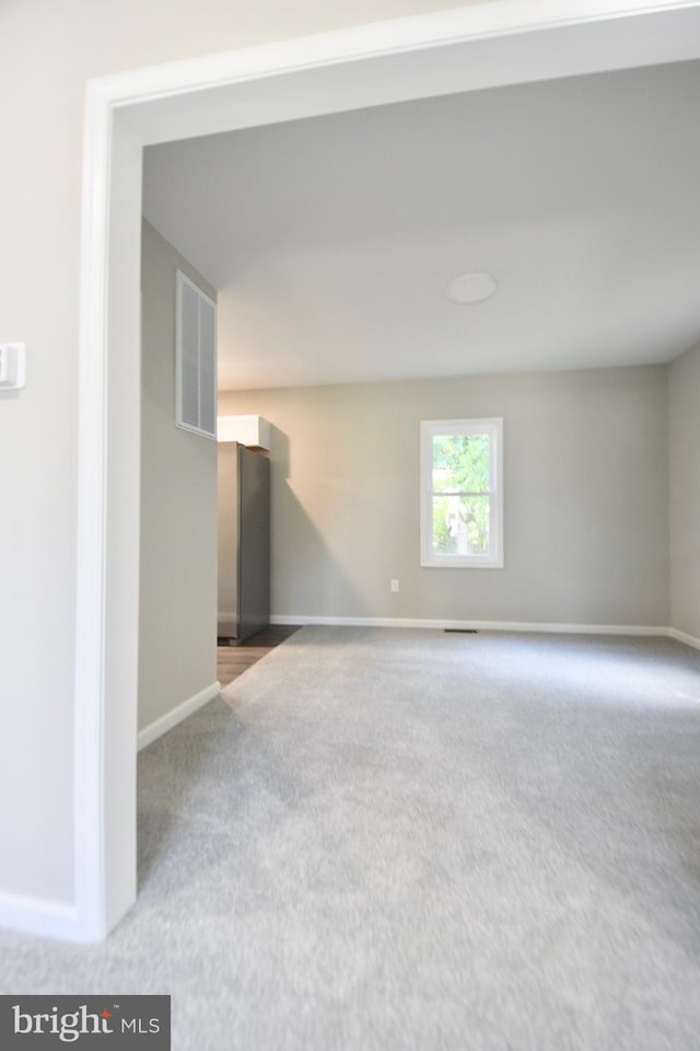 307 4th St, Seaford, DE 19973 - carpeted empty room featuring baseboards
