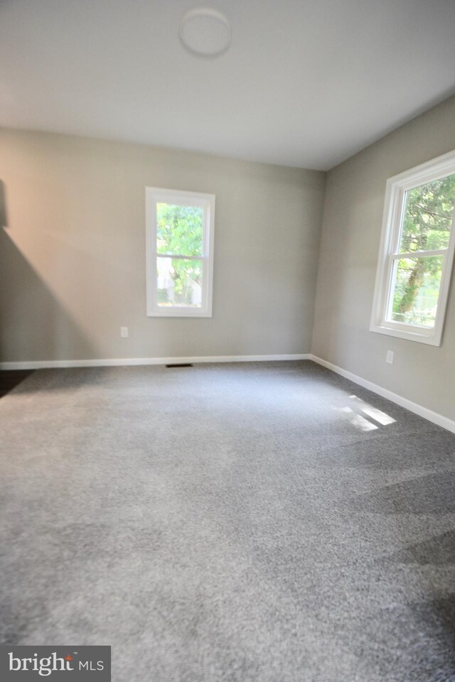 307 4th St, Seaford, DE 19973 - carpeted empty room with baseboards