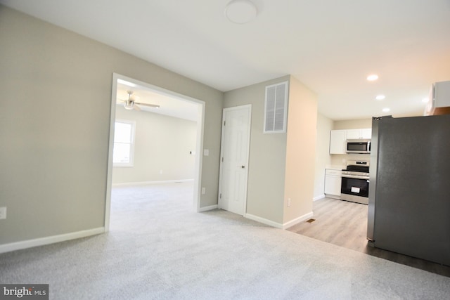 307 4th St, Seaford, DE 19973 - unfurnished living room featuring baseboards, light carpet, and recessed lighting