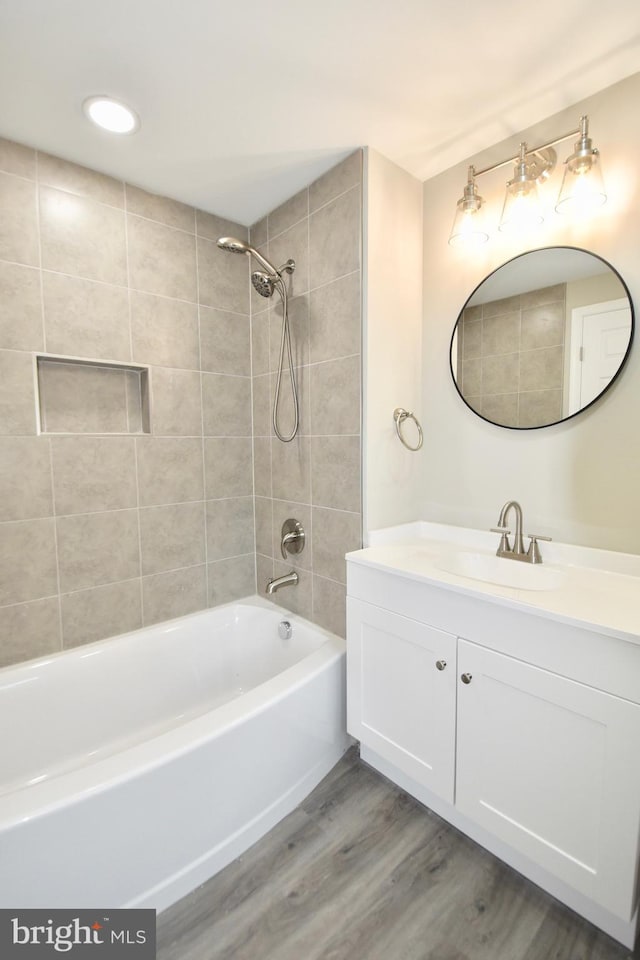 307 4th St, Seaford, DE 19973 - bathroom with wood finished floors, vanity, and bathtub / shower combination