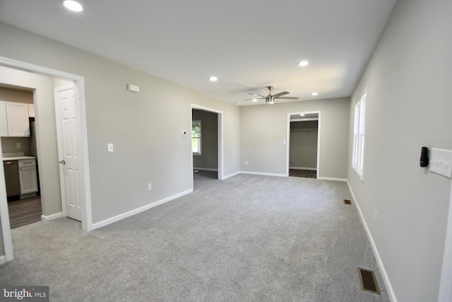 307 4th St, Seaford, DE 19973 - unfurnished bedroom featuring light carpet, recessed lighting, a walk in closet, baseboards, and ceiling fan
