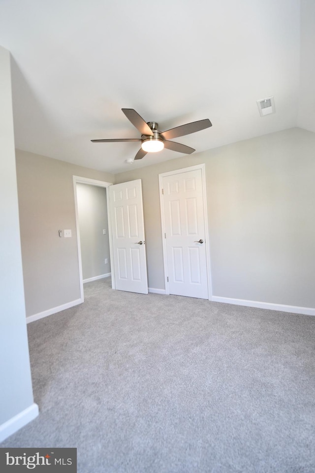 307 4th St, Seaford, DE 19973 - unfurnished bedroom with baseboards, carpet, and a ceiling fan