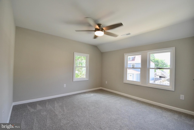 307 4th St, Seaford, DE 19973 - unfurnished room featuring a ceiling fan, dark colored carpet, baseboards, and lofted ceiling