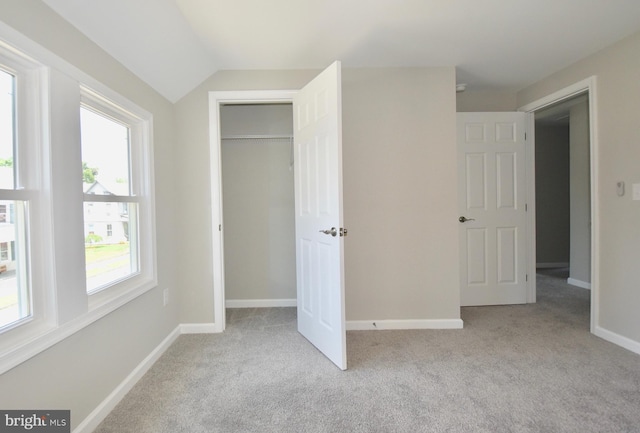 307 4th St, Seaford, DE 19973 - unfurnished bedroom with carpet flooring, baseboards, vaulted ceiling, and a closet