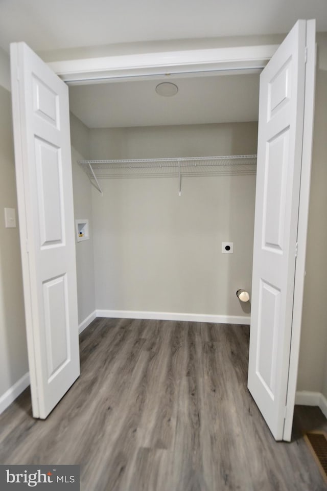 307 4th St, Seaford, DE 19973 - laundry area featuring electric dryer hookup, wood finished floors, baseboards, and hookup for a washing machine
