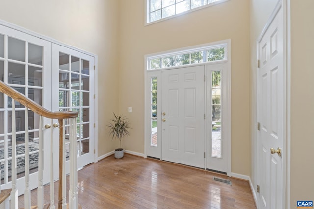 797 Willow Ridge Rd, Troy, VA 22974 - entrance foyer featuring wood-type flooring, a towering ceiling, and french doors