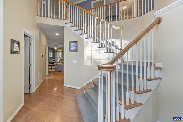 797 Willow Ridge Rd, Troy, VA 22974 - stairs with wood finished floors, a high ceiling, a ceiling fan, and recessed lighting