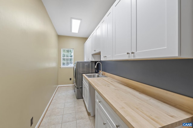 797 Willow Ridge Rd, Troy, VA 22974 - washroom with cabinet space, light tile patterned floors, and washer and clothes dryer