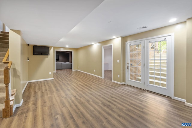 797 Willow Ridge Rd, Troy, VA 22974 - unfurnished living room with wood finished floors, stairway, and recessed lighting