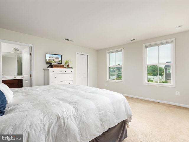 225 Norfolk Ln, Martinsburg, WV 25405 - bedroom featuring light carpet, baseboards, and ensuite bathroom