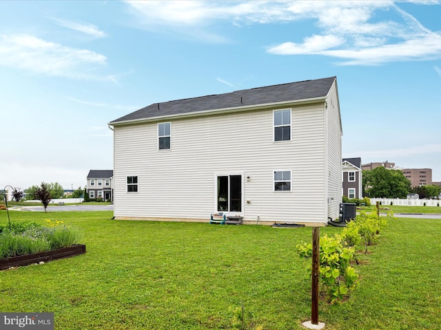 225 Norfolk Ln, Martinsburg, WV 25405 - rear view of house with a lawn and central AC unit