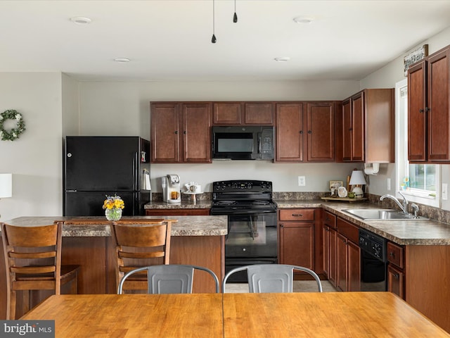 225 Norfolk Ln, Martinsburg, WV 25405 - kitchen with black appliances, a sink, a kitchen breakfast bar, and a center island