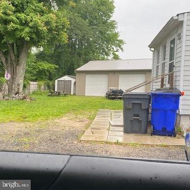 510 Magnolia Rd Unit 510, Joppa, MD 21085 - view of yard featuring an outdoor structure and a detached garage