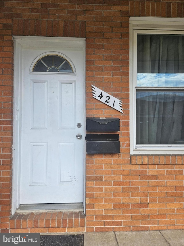 421 Folcroft St, Baltimore, MD 21224 - property entrance featuring brick siding
