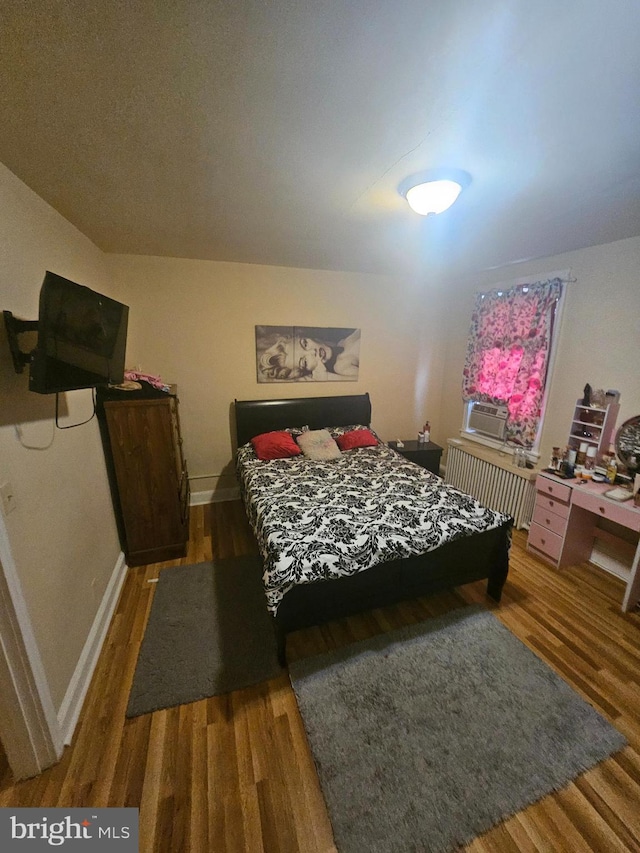 421 Folcroft St, Baltimore, MD 21224 - bedroom featuring wood finished floors and baseboards