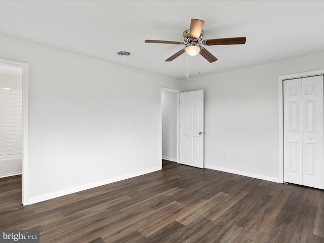 47 Picture Mountain Dr, Martinsburg, WV 25404 - unfurnished bedroom with dark wood finished floors, a closet, ceiling fan, and connected bathroom