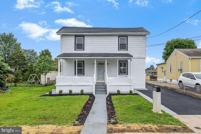 1225 Harper Ave, Woodlyn, PA 19094 - view of front of property featuring a porch, roof with shingles, and stucco siding