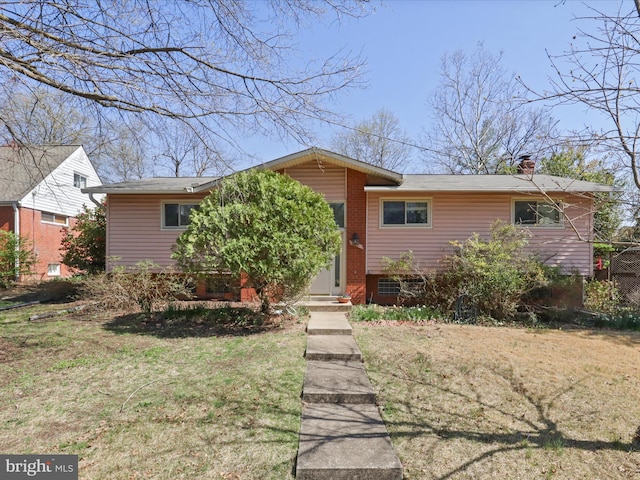 905 Peele Pl, Alexandria, VA 22304 - view of front of property featuring a front lawn, a chimney, and brick siding
