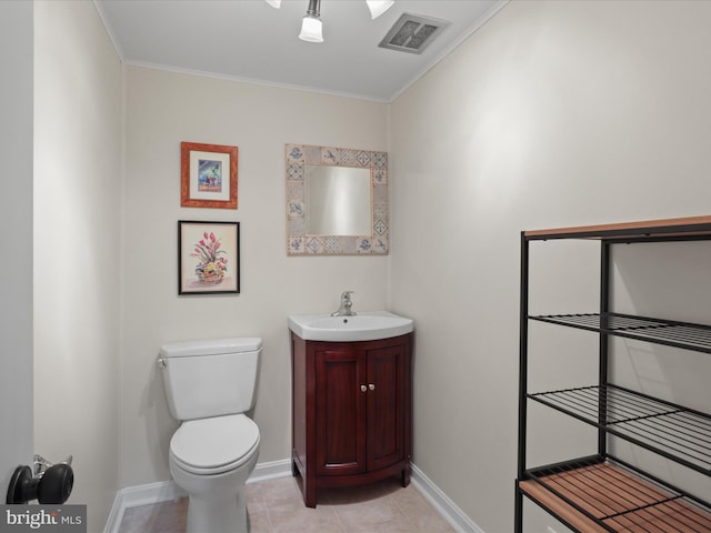 905 Peele Pl, Alexandria, VA 22304 - half bath featuring toilet, vanity, baseboards, ornamental molding, and tile patterned flooring