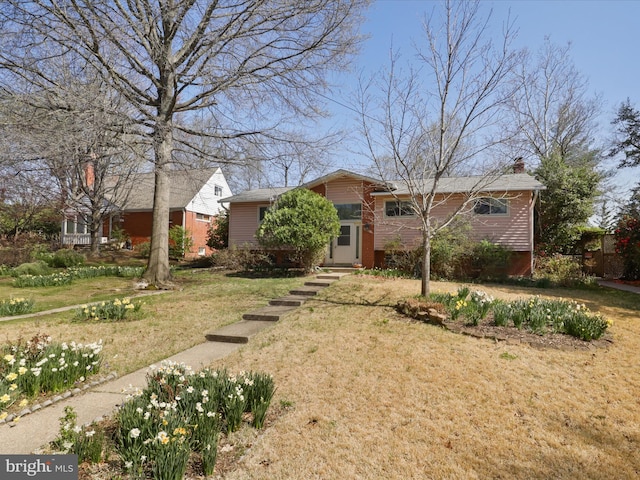 905 Peele Pl, Alexandria, VA 22304 - view of front of house featuring a front yard and brick siding