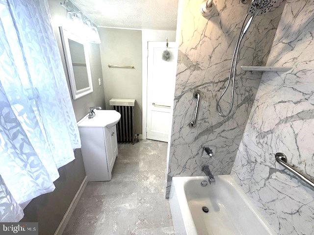 1512 River Rd, Upper Black Eddy, PA 18972 - bathroom featuring vanity,  shower combination, and radiator heating unit