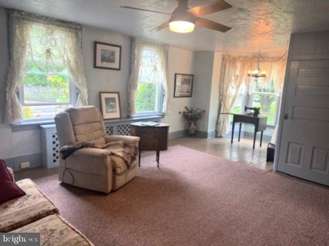 1512 River Rd, Upper Black Eddy, PA 18972 - living area with a ceiling fan, healthy amount of natural light, a chandelier, and carpet