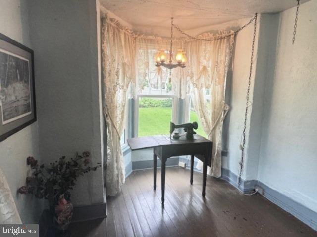 1512 River Rd, Upper Black Eddy, PA 18972 - dining room featuring a chandelier, wood-type flooring, and baseboards