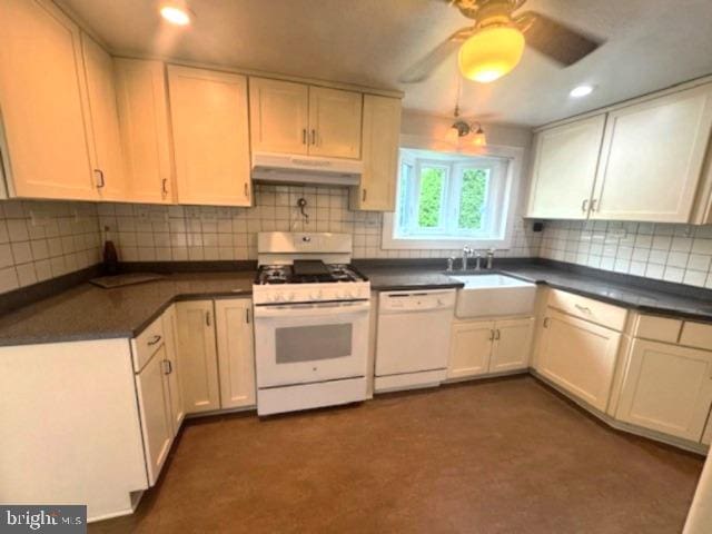 1512 River Rd, Upper Black Eddy, PA 18972 - kitchen featuring white appliances, under cabinet range hood, a sink, dark countertops, and recessed lighting