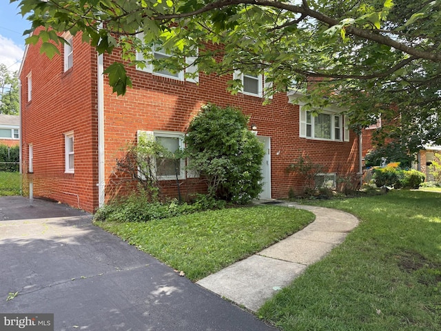 6412 24th St N, Arlington, VA 22207 - view of front facade featuring a front lawn and brick siding