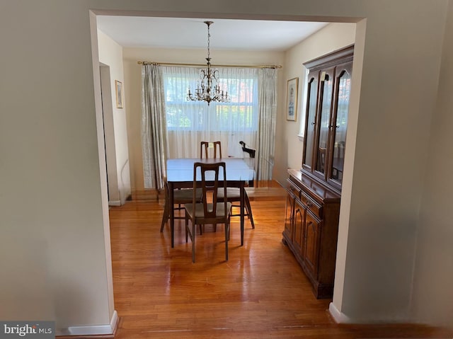 6412 24th St N, Arlington, VA 22207 - dining space with a chandelier, light wood-type flooring, and plenty of natural light