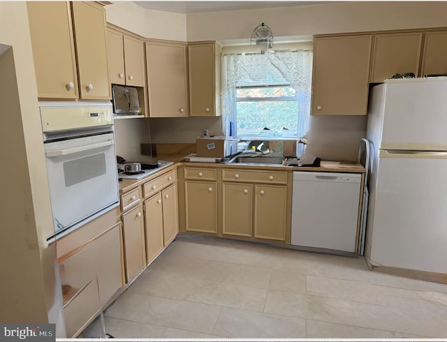 6412 24th St N, Arlington, VA 22207 - kitchen featuring white appliances, light tile patterned flooring, extractor fan, and cream cabinets