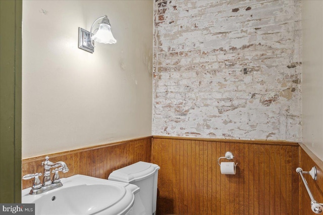 28 The Strand, New Castle, DE 19720 - bathroom with wainscoting, a sink, and toilet