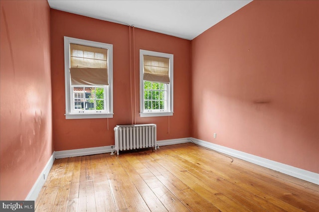 28 The Strand, New Castle, DE 19720 - spare room with radiator, light wood-type flooring, and baseboards