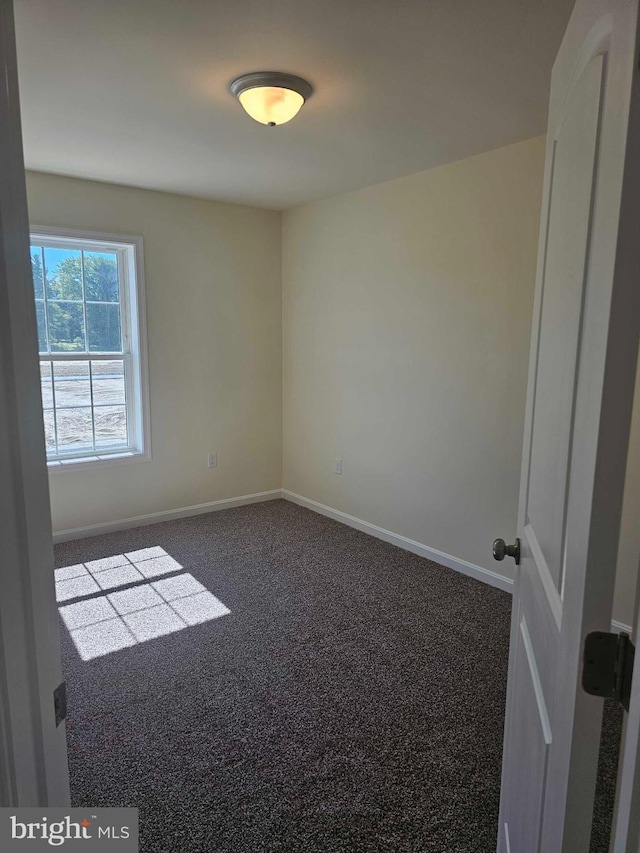 241 Rojan Rd Unit 114, Dover, DE 19901 - carpeted spare room with baseboards