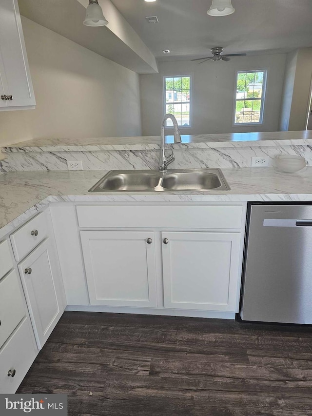 241 Rojan Rd Unit 114, Dover, DE 19901 - kitchen with dishwasher, a sink, white cabinets, and dark wood-style flooring