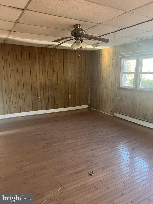6640 Pomfret Rd, La Plata, MD 20646 - spare room with a paneled ceiling, a baseboard radiator, ceiling fan, hardwood / wood-style floors, and baseboards