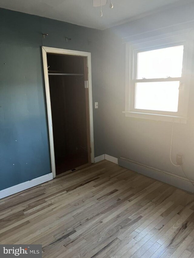 6640 Pomfret Rd, La Plata, MD 20646 - unfurnished bedroom featuring wood finished floors, a closet, and baseboards