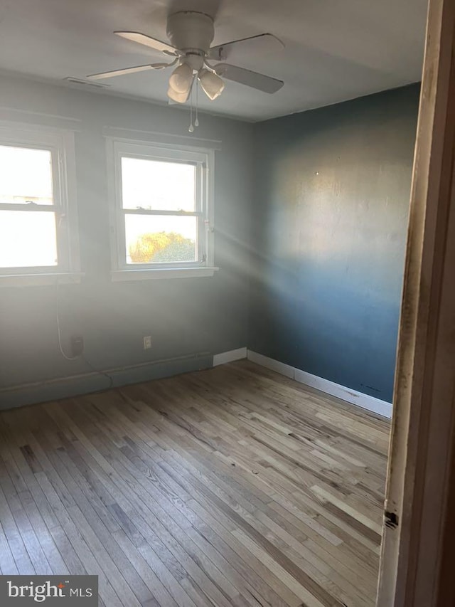 6640 Pomfret Rd, La Plata, MD 20646 - empty room with ceiling fan, wood-type flooring, and baseboards