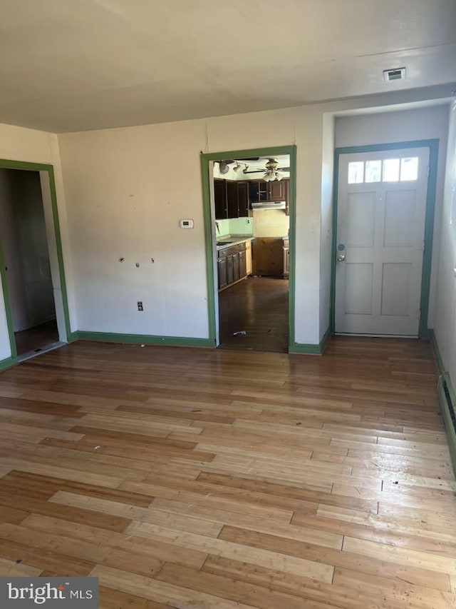 6640 Pomfret Rd, La Plata, MD 20646 - foyer entrance featuring hardwood / wood-style flooring and baseboards