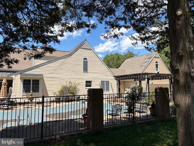 2515 Manion Dr, Williamsburg, VA 23185 - back of property featuring a pergola, a patio area, and roof with shingles