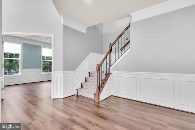 40578 Sculpin Ct, Aldie, VA 20105 - staircase with a decorative wall, a wainscoted wall, and wood finished floors