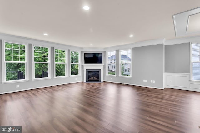 40578 Sculpin Ct, Aldie, VA 20105 - unfurnished living room with dark wood finished floors, a glass covered fireplace, recessed lighting, and ornamental molding