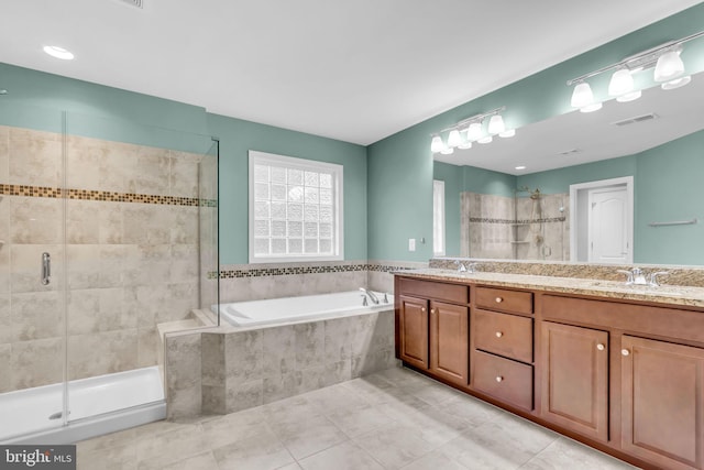 40578 Sculpin Ct, Aldie, VA 20105 - bathroom with a garden tub, double vanity, a stall shower, and tile patterned flooring