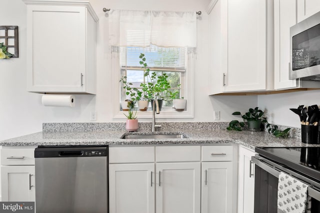 12 Parkview Dr, Carlisle, PA 17013 - kitchen featuring appliances with stainless steel finishes, white cabinetry, and light stone countertops